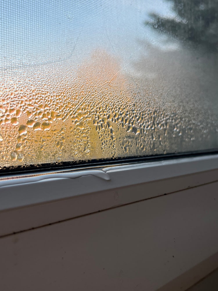 Close-up photo of condensation and water droplets on window glas